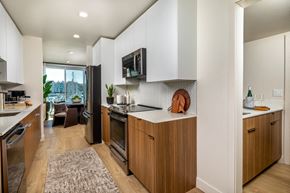 Marina Del Rey apartment for rent - A modern kitchen with wooden cabinets and a large island.