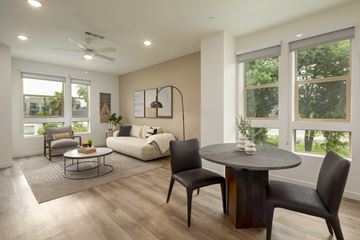Los Angeles apartment for rent - A modern living room with a round table and chairs.