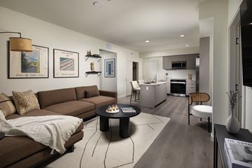 Monrovia apartment for rent - A living room with a brown couch and a coffee table.