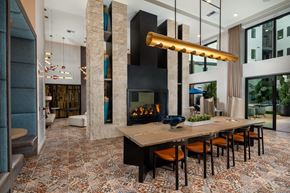 Santa Ana apartment for rent - a dining room with a table and chairs in front of a fireplace