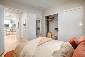 Los Angeles apartment for rent - A bedroom with a large bed and a teddy bear on it.