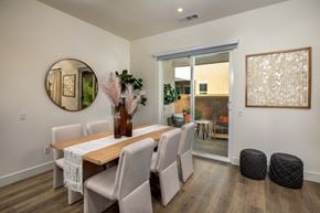 La Quinta apartment for rent - a dining room with a table and chairs and a mirror on the wall