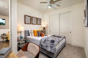 La Quinta apartment for rent - a bedroom with a bed and a ceiling fan