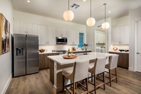 La Quinta apartment for rent - a kitchen with a large island and a stainless steel refrigerator