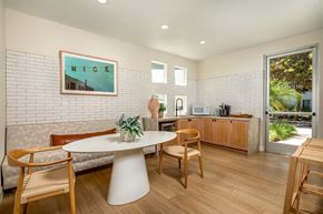 Pomona apartment for rent - A dining area with a white table and chairs.