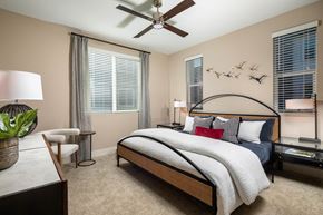Rancho Cucamonga apartment for rent - a bedroom with a bed and a ceiling fan