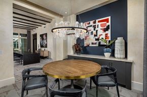 Rancho Cucamonga apartment for rent - a dining room with a round table and a chandelier