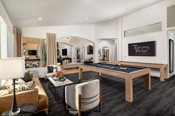 Temecula apartment for rent - A living room with a pool table and a sign that says Tuscany Ridge.