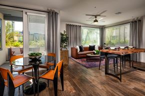 North Hollywood apartment for rent - A modern dining room with a glass table and chairs.