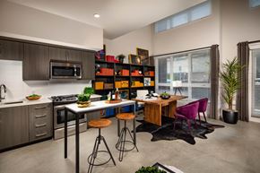 North Hollywood apartment for rent - A modern kitchen with a dining table and chairs.