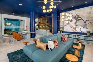 San Diego apartment for rent - a living room with blue walls and a blue couch