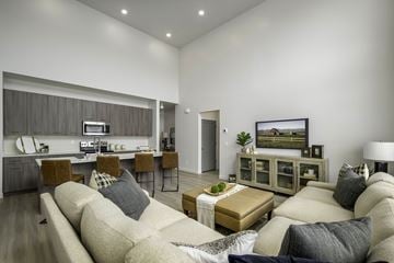 Sandy townhouse for rent - a living room with a couch and a table