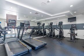 San Diego apartment for rent - A gym with treadmills, exercise bikes, and elliptical machines.