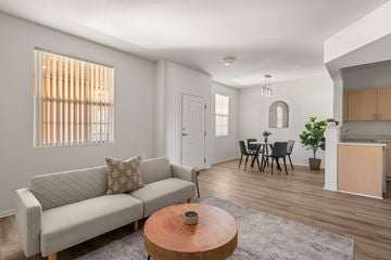 San Diego apartment for rent - A living room with a grey couch and a wooden coffee table.