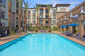 Torrance apartment for rent - A large swimming pool in front of a resort.