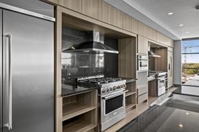 Salt Lake City apartment for rent - A modern kitchen with stainless steel appliances and wooden accents.