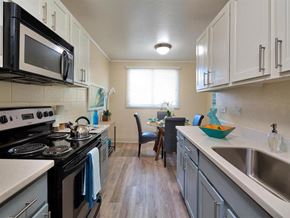 Kapolei apartment for rent - a kitchen with a stove and a sink and a microwave