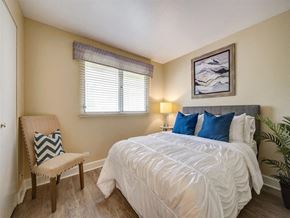 Kapolei apartment for rent - a bedroom with a bed and a chair and a window