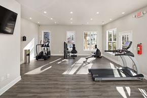 Stone Mountain apartment for rent - a gym with treadmills and other exercise equipment and a tv