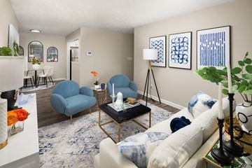 Stone Mountain apartment for rent - A living room with a blue chair and a white couch.