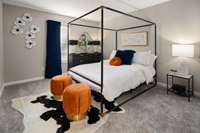 Stone Mountain apartment for rent - a bedroom with a bed and a dog on the floor