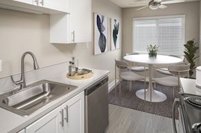 Beaverton apartment for rent - Kitchen and dining space for a circular table with chairs at Canyon Park Apartments, Beaverton, OR 97005