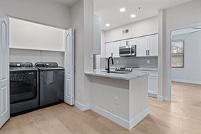 Phoenix apartment for rent - a kitchen with white cabinets and a white counter top