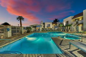 Scottsdale apartment for rent - a swimming pool with a colorful sunset in the background