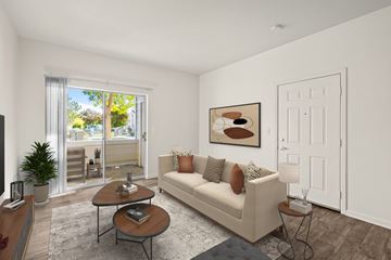 Highlands Ranch apartment for rent - A living room with a couch, a coffee table, and a painting on the wall.