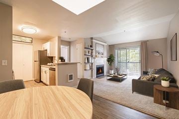 Everett apartment for rent - A modern kitchen with a dining table and a couch.