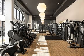 Denver apartment for rent - A gym with treadmills, weights, and exercise machines.