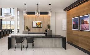 Aurora apartment for rent - A modern dining room with a long table and chairs.