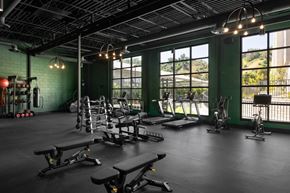 Los Angeles apartment for rent - A gym with a variety of equipment including treadmills, weights, and benches.