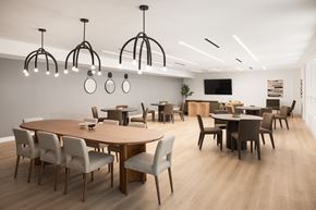 Los Angeles apartment for rent - A modern dining room with a large table and chairs.