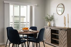 Broomfield townhouse for rent - a dining room with a table with a bowl of oranges on it
