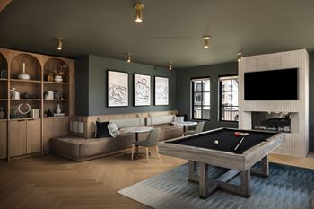 Game lounge with indoor fireplace