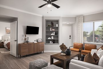 Aurora apartment for rent - A modern living room with a brown leather couch and a wooden coffee table.