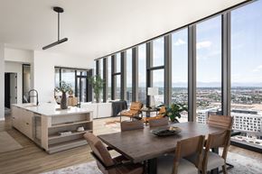 Denver apartment for rent - A modern kitchen with a dining table and chairs.