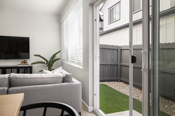 Aurora apartment for rent - A living room with a grey couch and a wooden table.