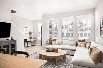 Aurora townhouse for rent - A living room with a white couch and a coffee table.