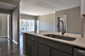 San Antonio apartment for rent - A kitchen with a sink and cabinets at The Quarry Alamo Heights Apartments, Texas
