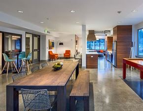 Bothell apartment for rent - A modern dining room with a wooden table and chairs.