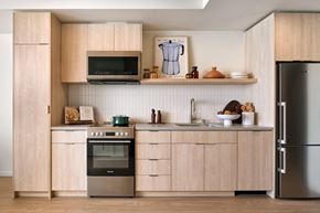 San Francisco apartment for rent - a kitchen with wooden cabinets and stainless steel appliances