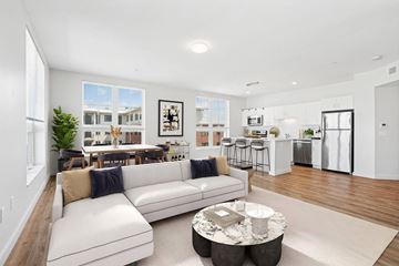 Beverly apartment for rent - A modern living room with a white sofa and a coffee table.