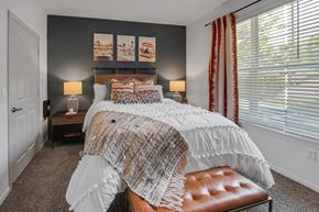 Overland Park apartment for rent - a bedroom with a bed and a window