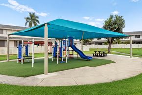 Kapolei apartment for rent - play area with sides and jungle gym. Covered to provide shade. grass surrounding,