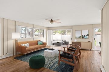 Ewa Beach apartment for rent - a living room with a couch and chairs and a dining table