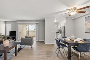 Sacramento apartment for rent - A modern dining room with a table set for two and a television in the corner.
