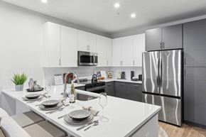 Fredericksburg apartment for rent - a white kitchen with stainless steel appliances and a white counter top