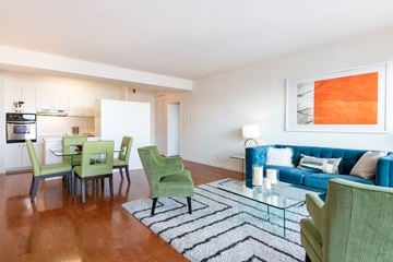San Francisco apartment for rent - a living room and dining room with a blue couch and green chairs